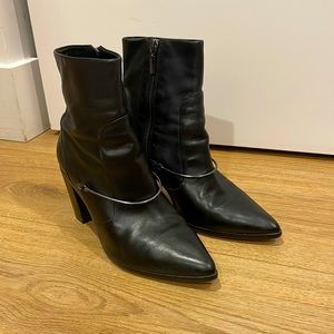 Schutz high heel boots with a ring on the surface